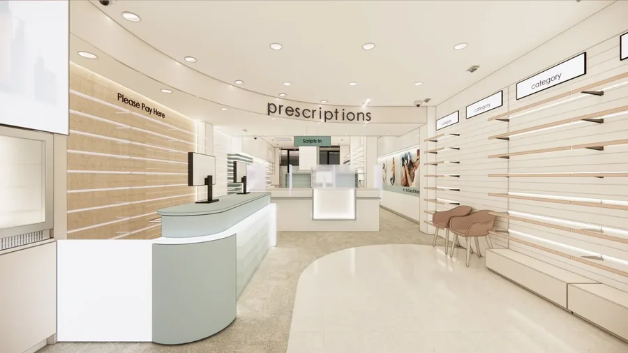 Curved pharmacy prescription counter with "Please Pay Here" and "Prescriptions" signage and timber-slat feature wall