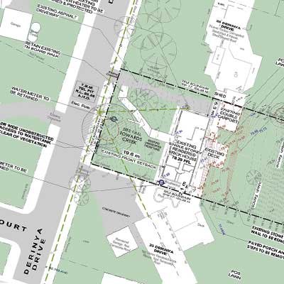 A detailed site plan showing existing and proposed layouts for a property, including trees, building outlines, setbacks, and various measurements.