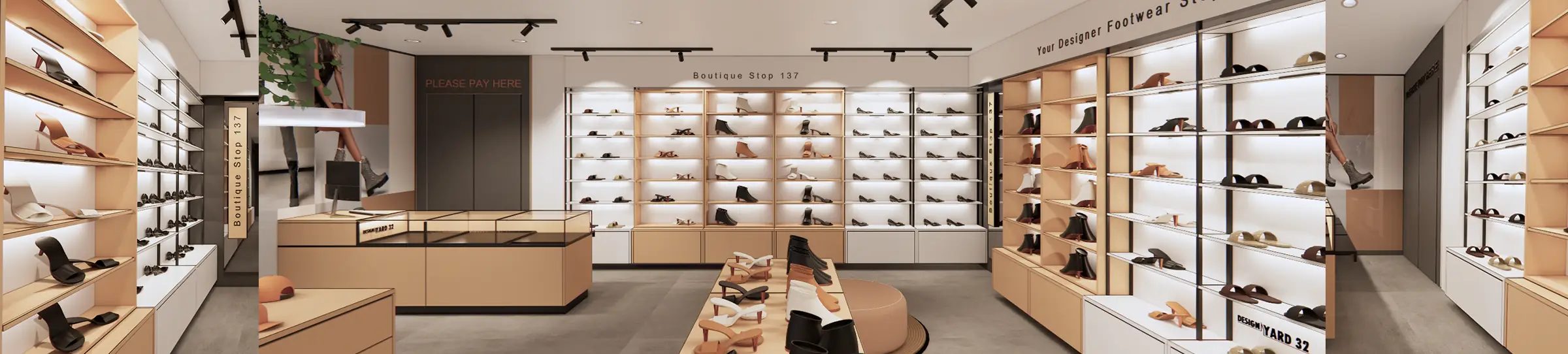 Interior view of a shoe store with shelves of various women's shoes, including boots, heels, and sandals, displayed on light-colored wooden shelves and white walls, with central display tables and signage indicating a designer footwear boutique.